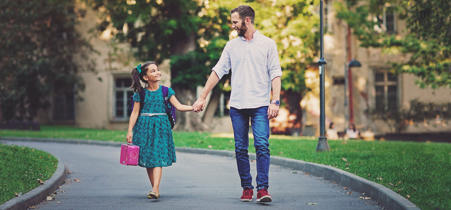 dad walking with daughter