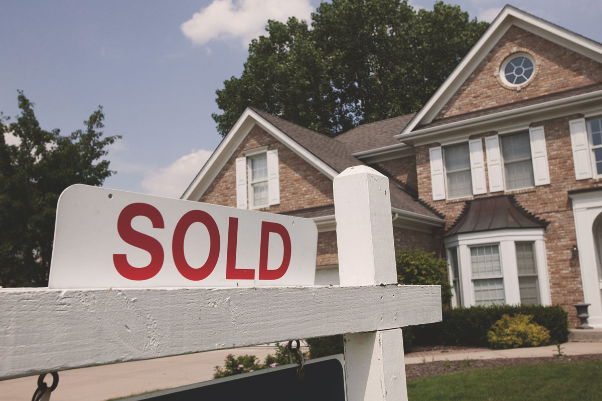 sold sign in front of house